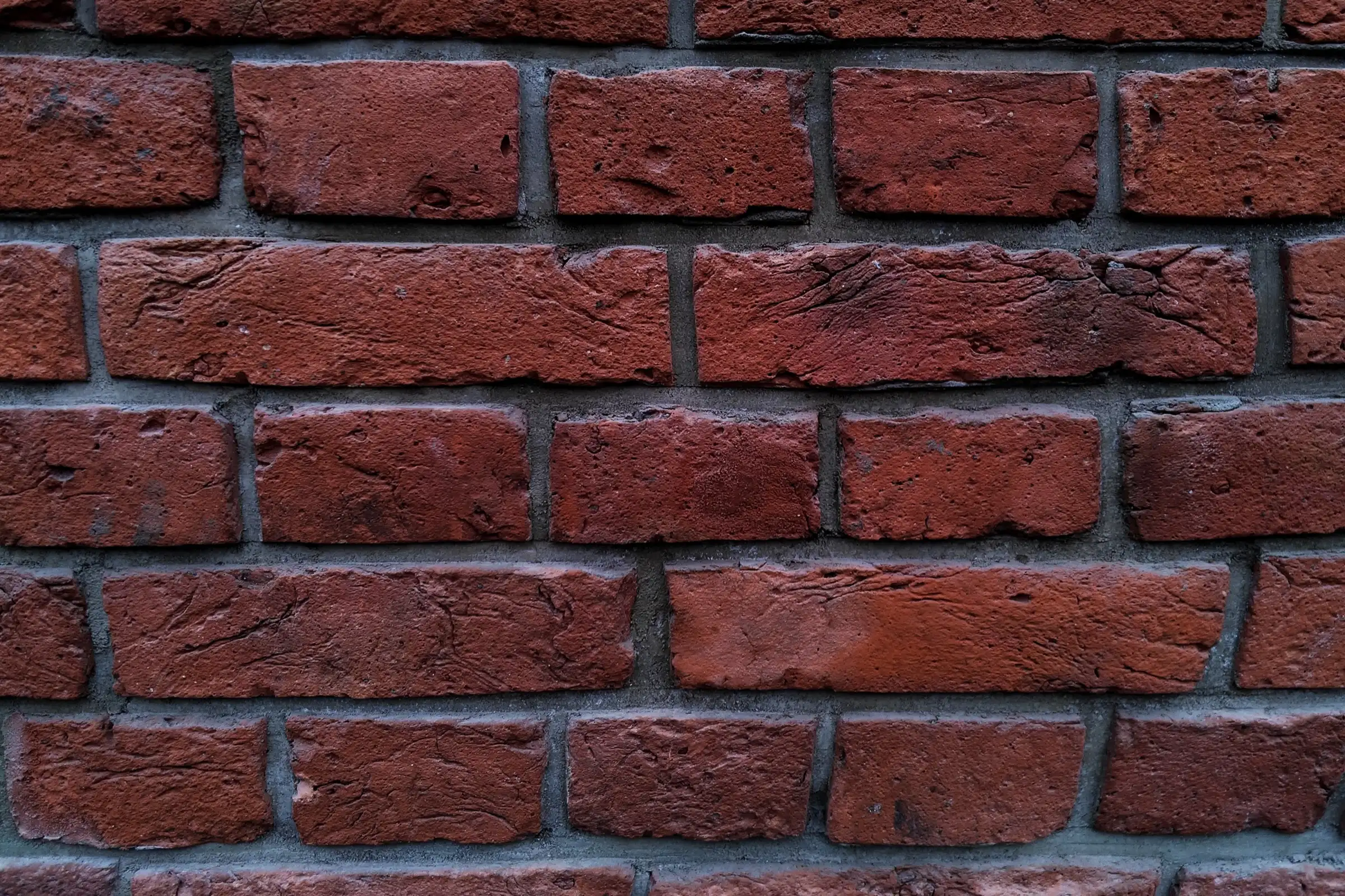 Close-up of a red brick masonry wall by Lastovica Masonry in Omaha, NE